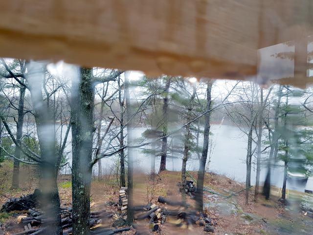 The blurry view from a window at the rain soaked cottage