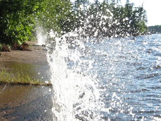 Waves crashing on the retaining wall at Round Lake…