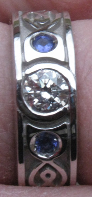 White gold, diamond and two tanzanites with celtic knot inlay