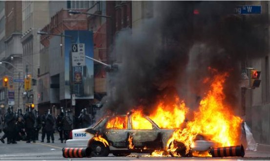 Burning car in downtown Toronto… (Photo from CBC)